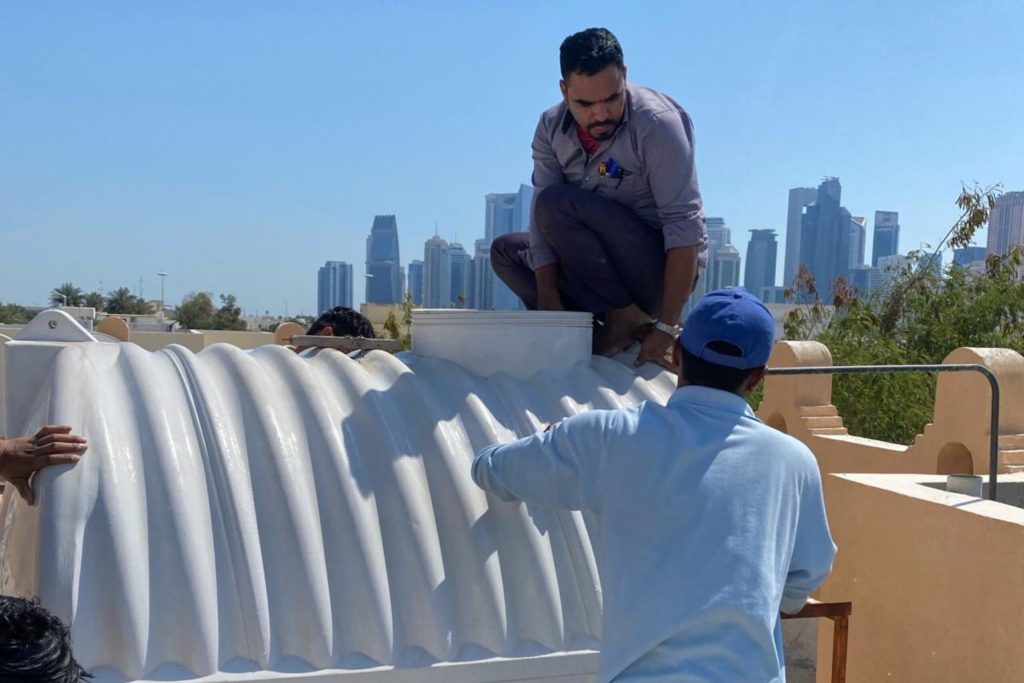 Water tank cleaning in progress using safe, effective methods