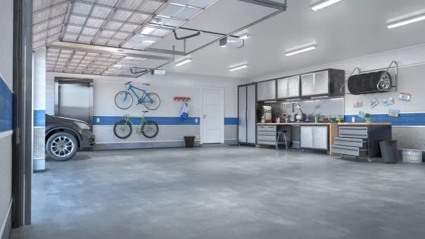 Professional garage deep cleaning setup with pressure washer and cleaning tools
