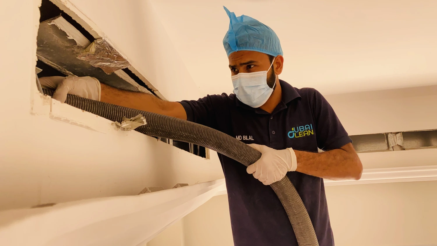 Technician performing AC duct cleaning to improve indoor air quality and system efficiency
