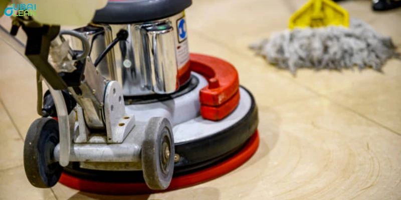 Technician using a floor polishing machine on shiny vinyl flooring

