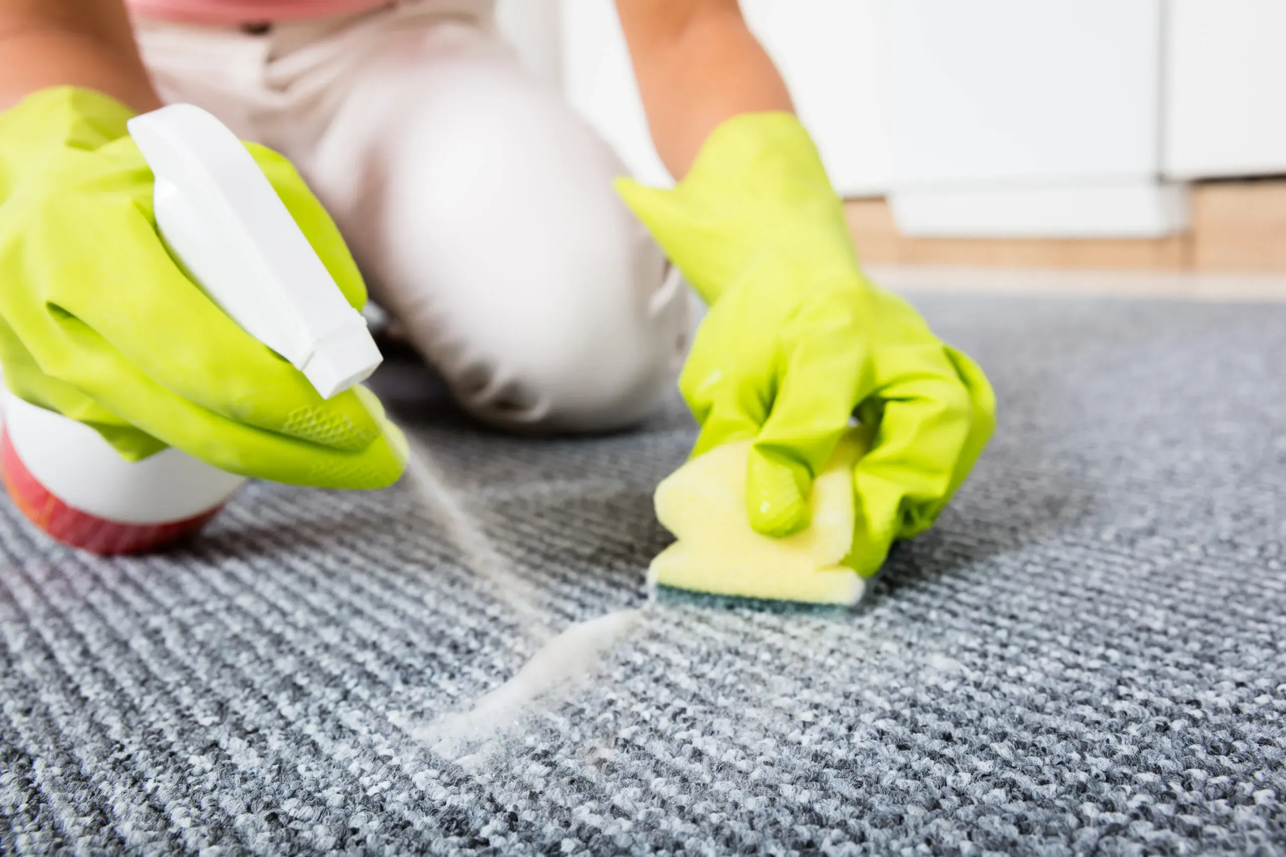 Dubai home interior prepared for carpet cleaning with furniture moved aside and protective materials placed strategically for professional cleaning service.