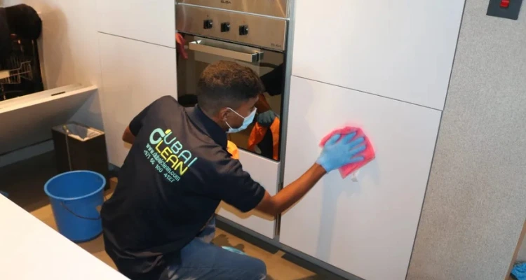 Thorough kitchen deep cleaning in progress, targeting hidden grease and grime.