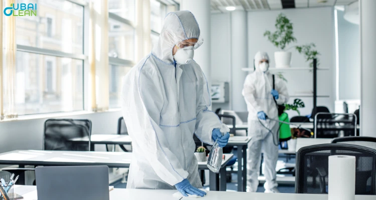 Office deep cleaning process – professionals sanitizing workplace surfaces and equipment