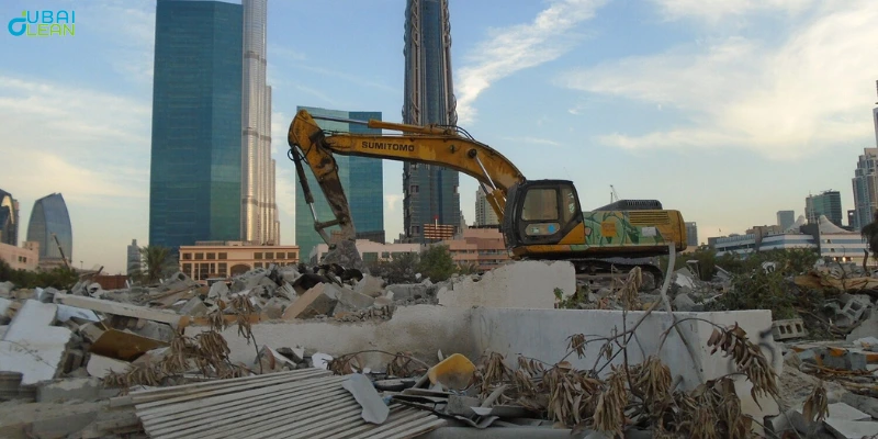 Excavator tearing down a villa as part of demolition services in Dubai