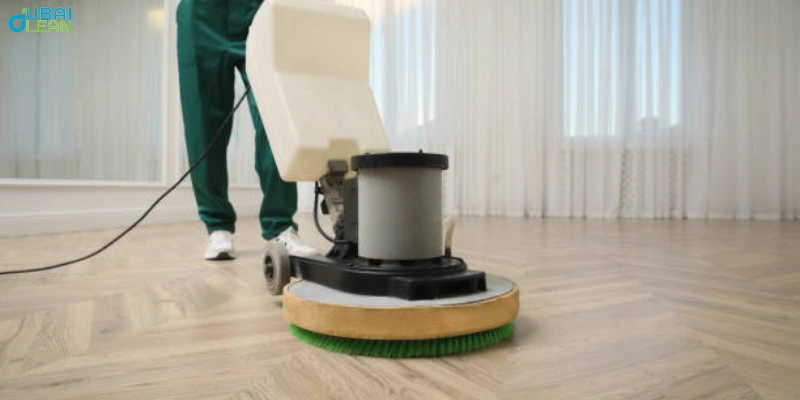 Vinyl floor polishing by expert using a buffing machine for a glossy finish